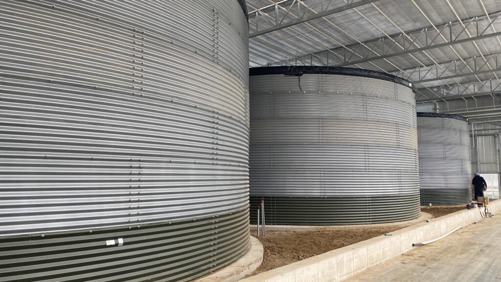 Water tanks inside completed H&A Farms greenhouse