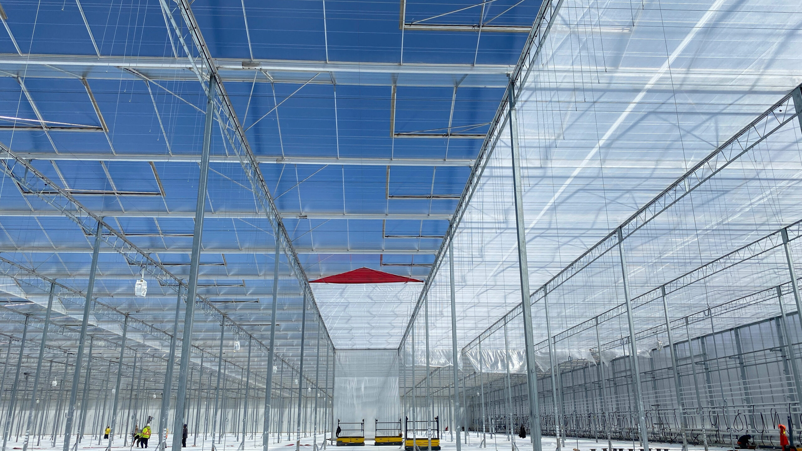 Screen retrofitting project in an existing greenhouse structure